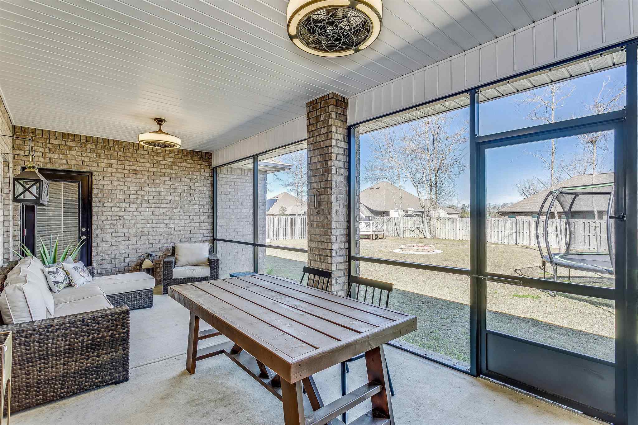 2792 Elkhorn Drive Pace, FL 32571 - Photo 43 of 50 a balcony with furniture and a large window