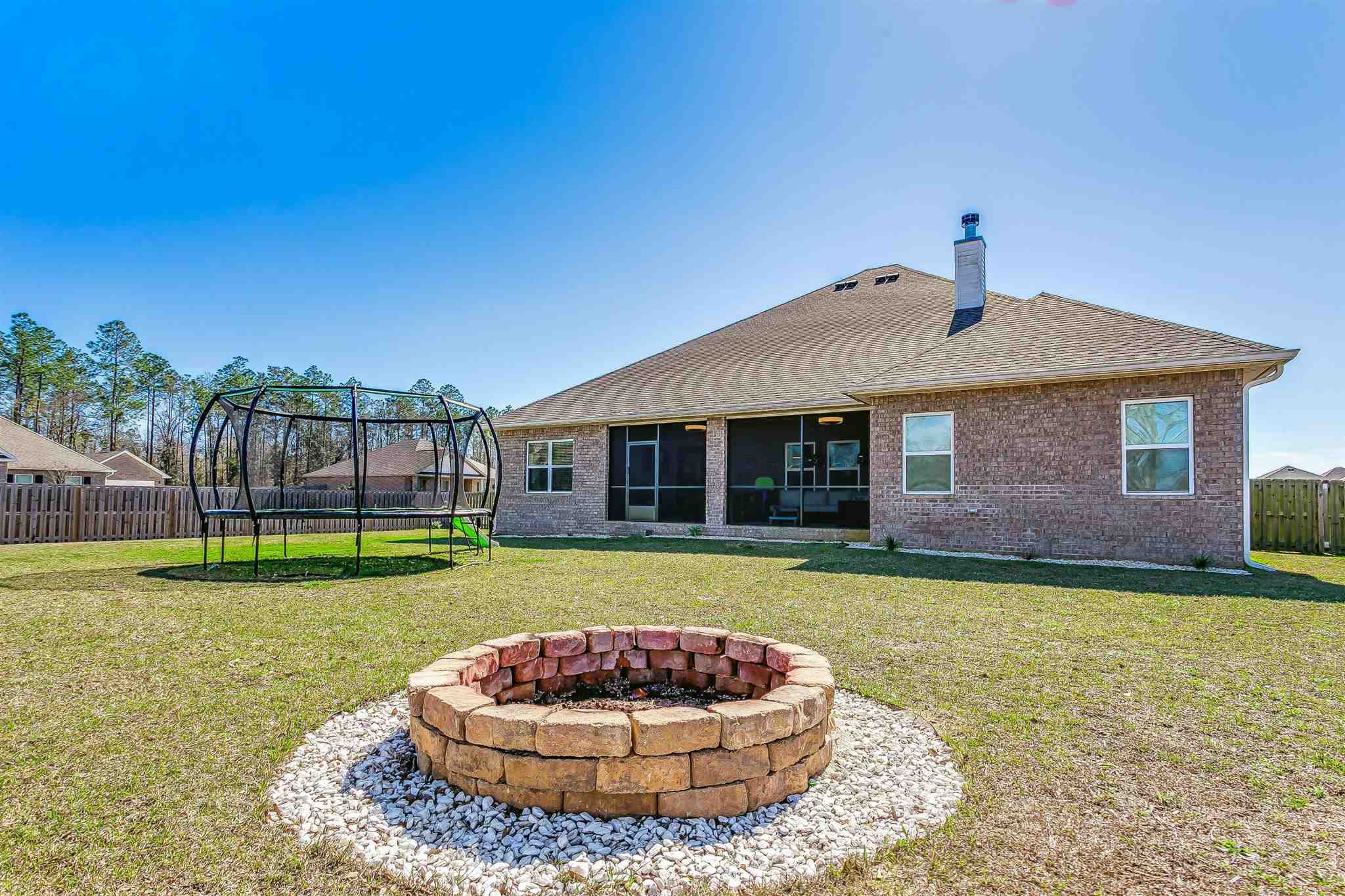 2792 Elkhorn Drive Pace, FL 32571 - Photo 47 of 50 a view of a house with a yard
