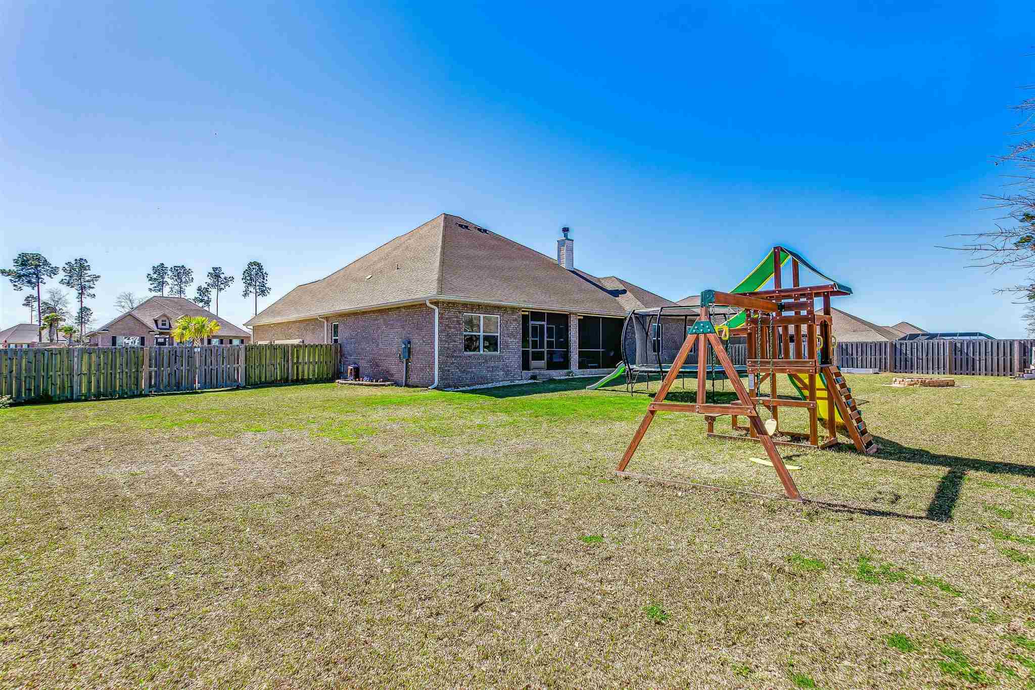 2792 Elkhorn Drive Pace, FL 32571 - Photo 50 of 50 a view of an house with swimming pool and a yard