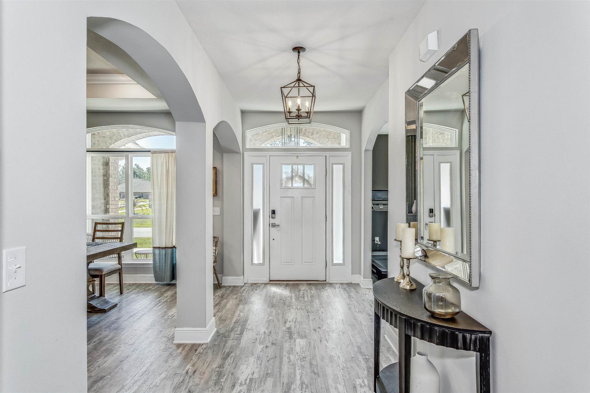 2792 Elkhorn Drive Pace, FL 32571 - Photo 5 of 50 a view of a room with wooden floor windows and entryway
