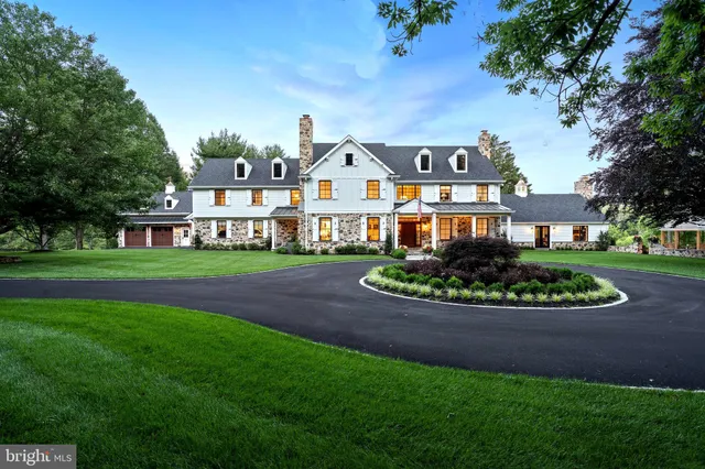 a patio with a table and chairs under an umbrella