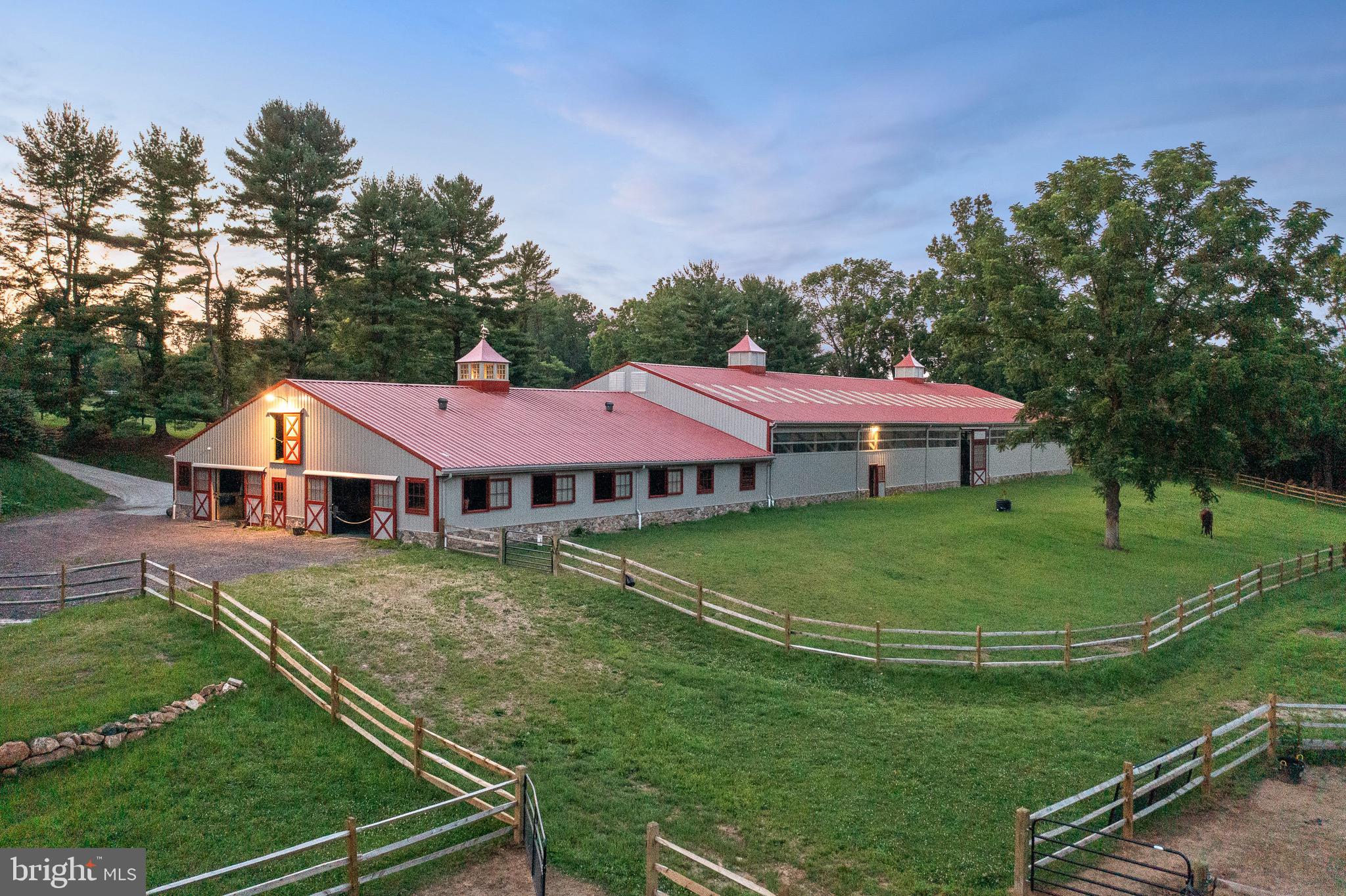 239 Spring Road Malvern, PA 19355 - Photo 15 of 29 a view of a white house with a big yard plants and large trees
