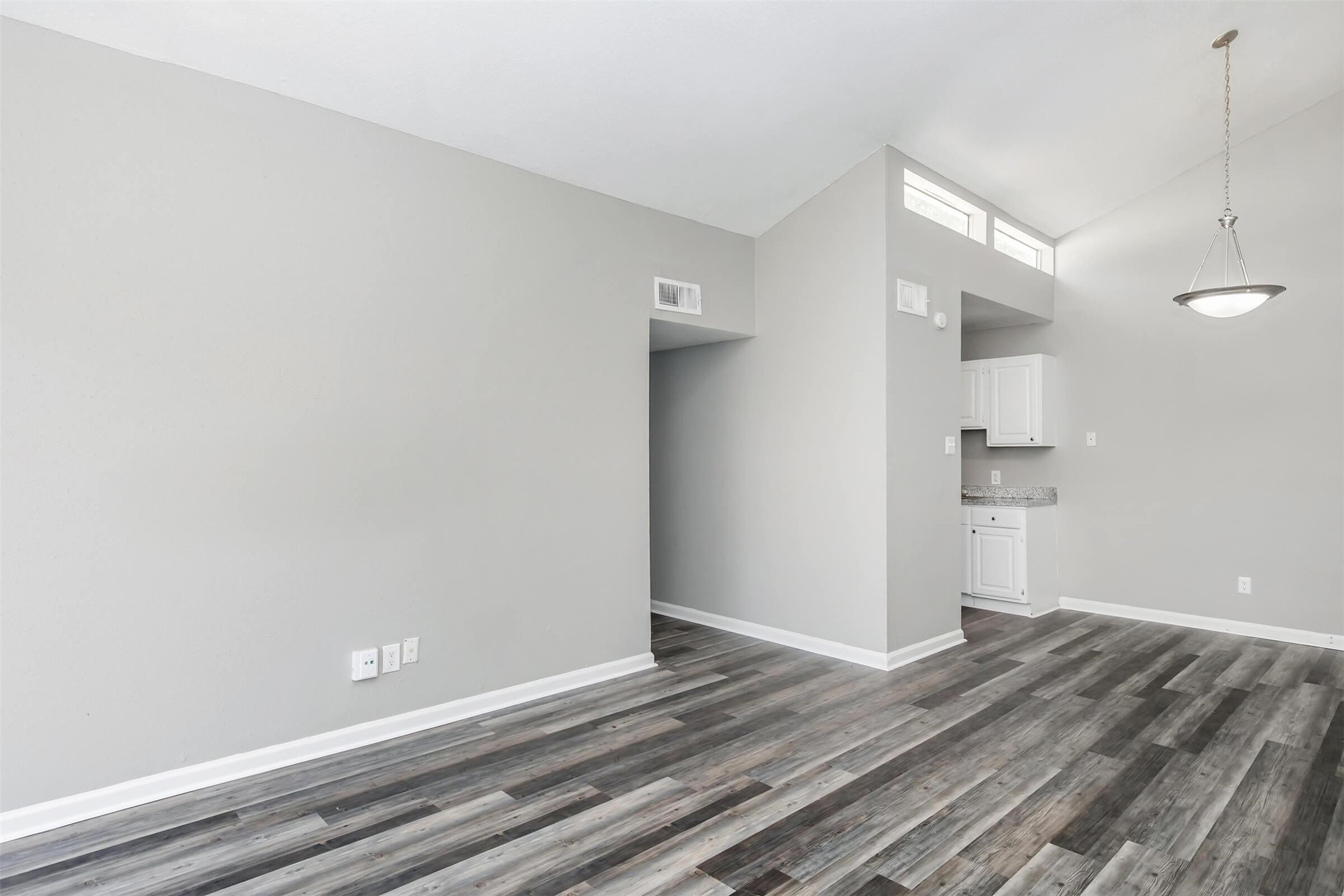 18001 Cypress Trace Road, Unit 504 Houston, TX 77090 - Photo 5 of 34 a view of empty room with wooden floor and window