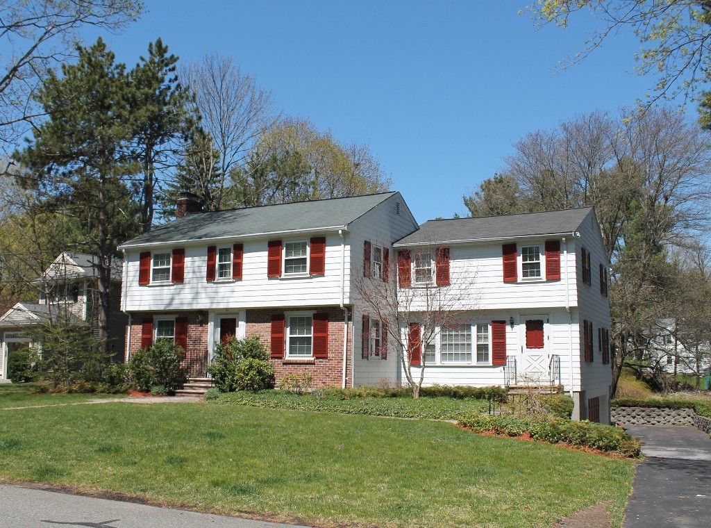 10 Longfellow Road Lexington, MA 02420 - Photo 1 of 29 a front view of a residential apartment building with a yard