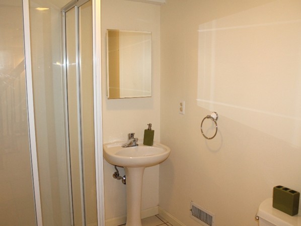 10 Longfellow Road Lexington, MA 02420 - Photo 26 of 29 a bathroom with a sink and mirror