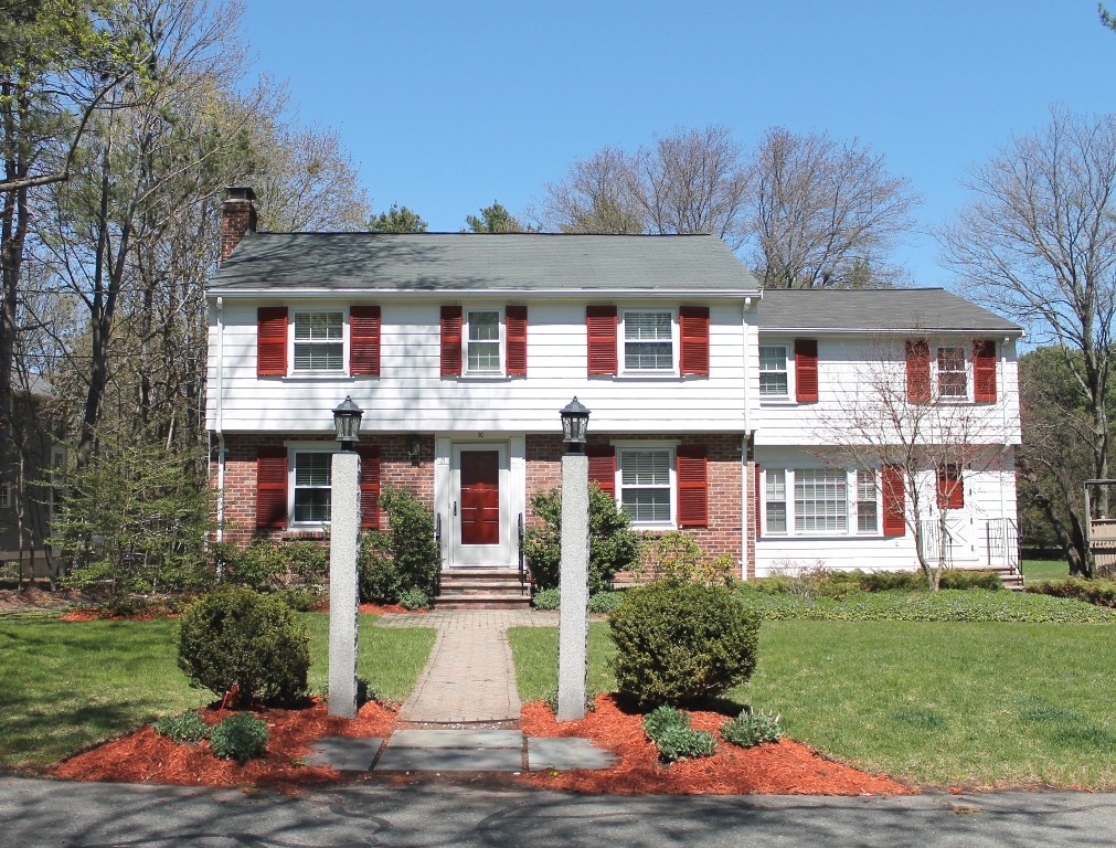 10 Longfellow Road Lexington, MA 02420 - Photo 29 of 29 a front view of a residential apartment building with a yard