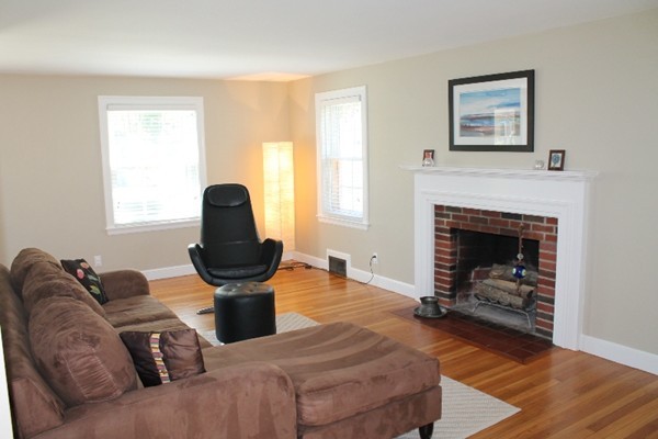 10 Longfellow Road Lexington, MA 02420 - Photo 3 of 29 a living room with furniture a window and a fireplace