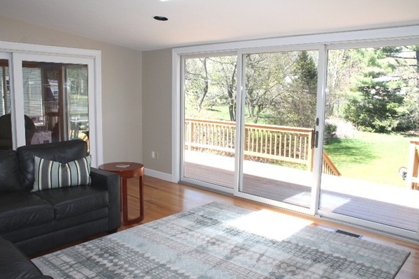 10 Longfellow Road Lexington, MA 02420 - Photo 5 of 29 a bedroom with a bed and wooden floor