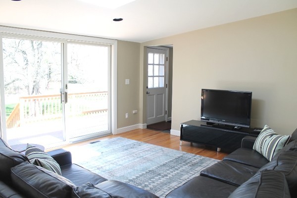 10 Longfellow Road Lexington, MA 02420 - Photo 6 of 29 a living room with furniture and a flat screen tv