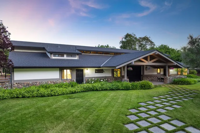 a front view of a house with a yard