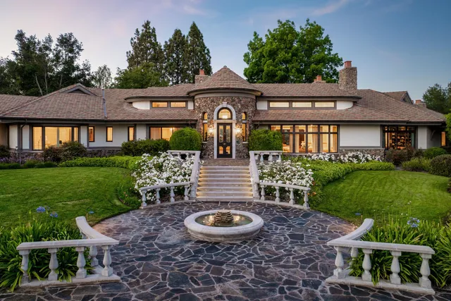 a front view of a house with garden