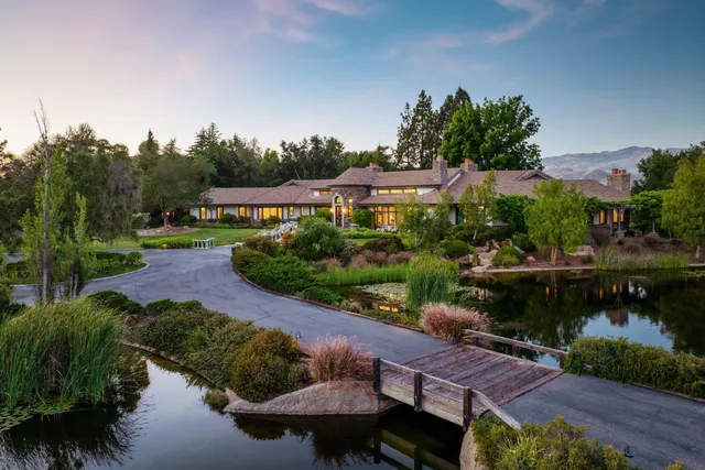 a view of a lake with a house in the background