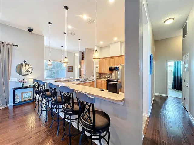 a dining room with furniture and window