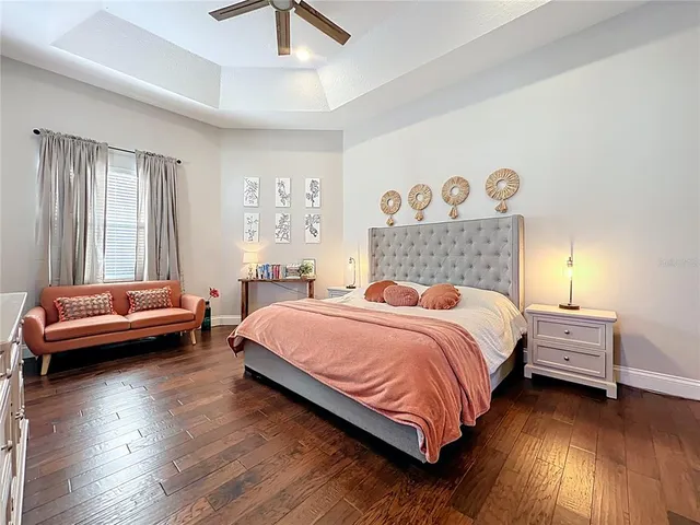 a white bath tub sitting in a bathroom next to a toilet