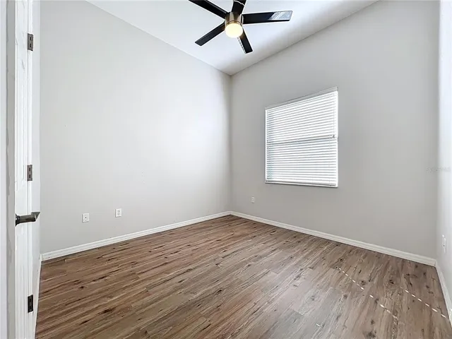 a view of a workspace with furniture and a bookshelf