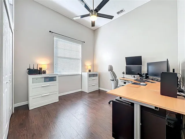 a bedroom with a large bed and a large window
