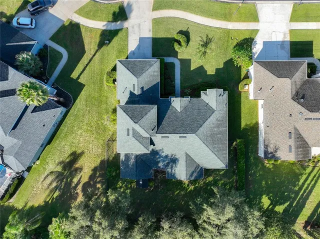 a view of a tennis ground with a small pool