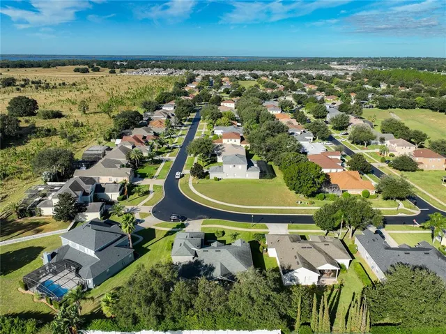 a view of a wooden deck with a yard