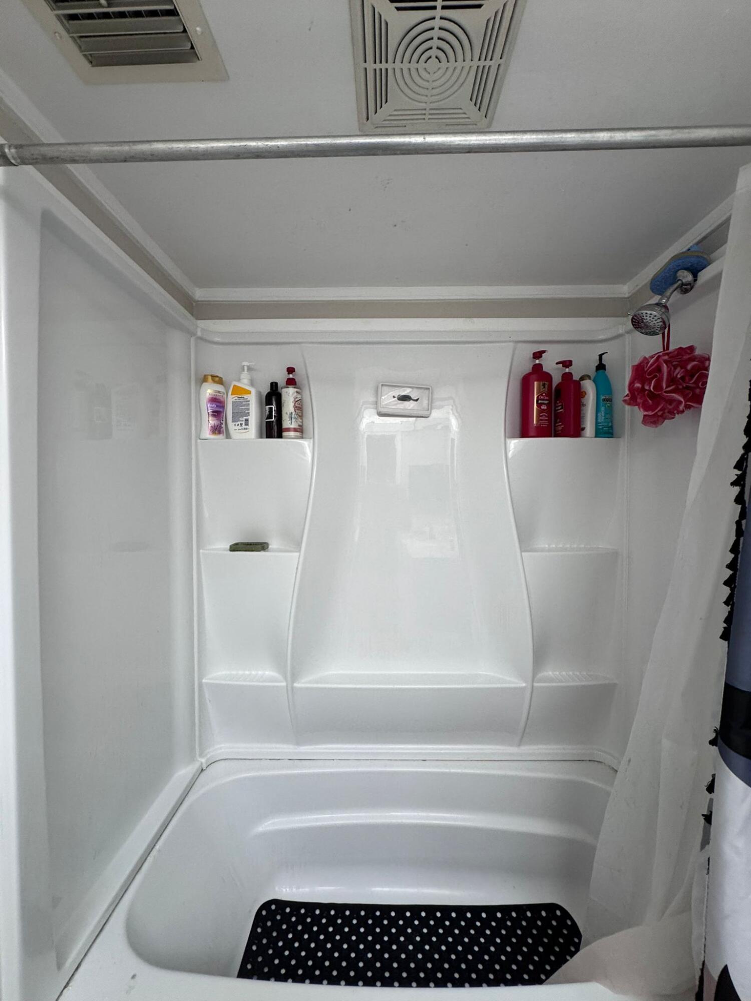 22715 Southwest 66th Avenue, Unit 105 Boca Raton, FL 33428 - Photo 12 of 13 a bathroom with a bathtub and shower