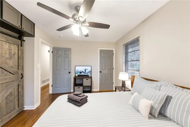 a bedroom with furniture and a fireplace