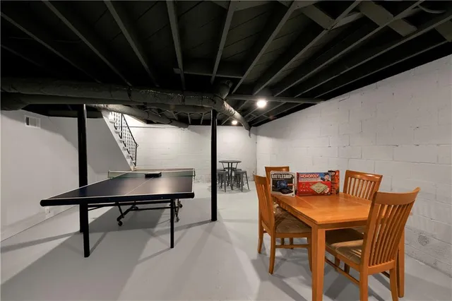 a view of a dining room with furniture and a table