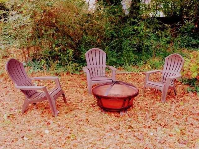 a view of a chairs and fire pit