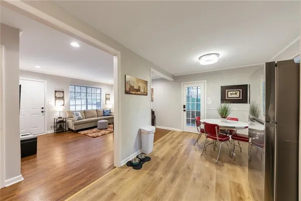 a view of a livingroom with furniture and a flat screen tv