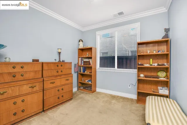 a view of room with window and cabinet