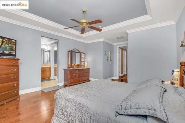 a bedroom with a large bed and dresser