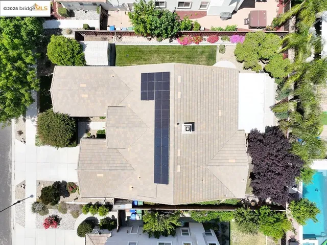 an aerial view of house with yard