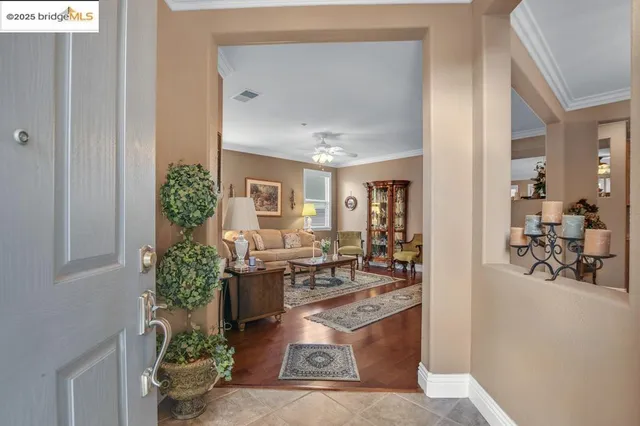 a living room with furniture and flowers