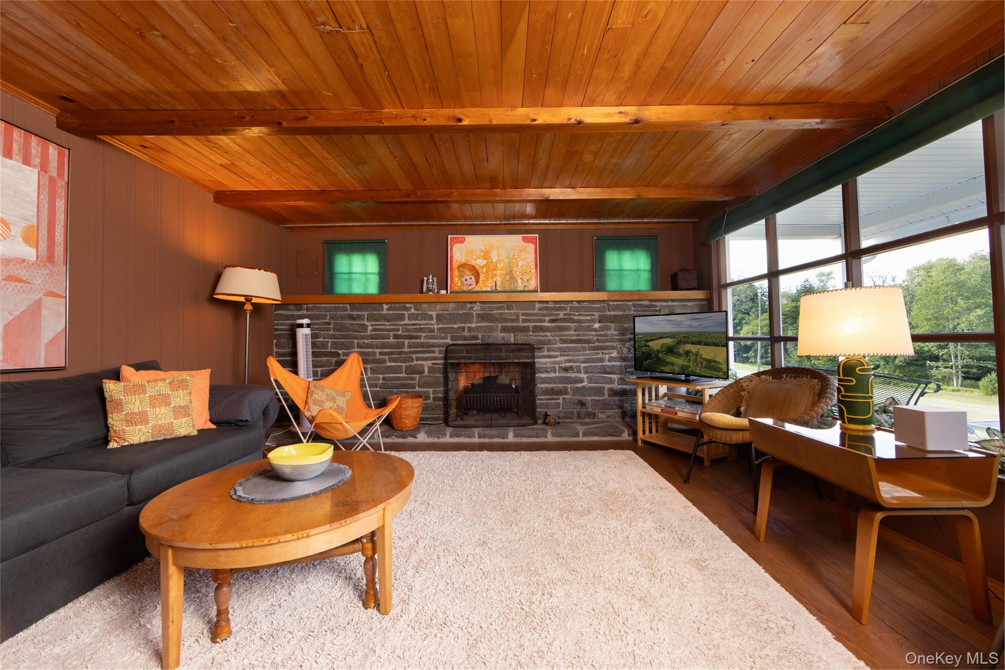 49 Crumley Van Vactor Road Ferndale, NY 12734 - Photo 46 of 50 Living room featuring wooden ceiling with exposed beams, a stone fireplace, and wood finished floors