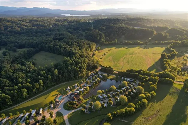 an outdoor sitting area with lake view