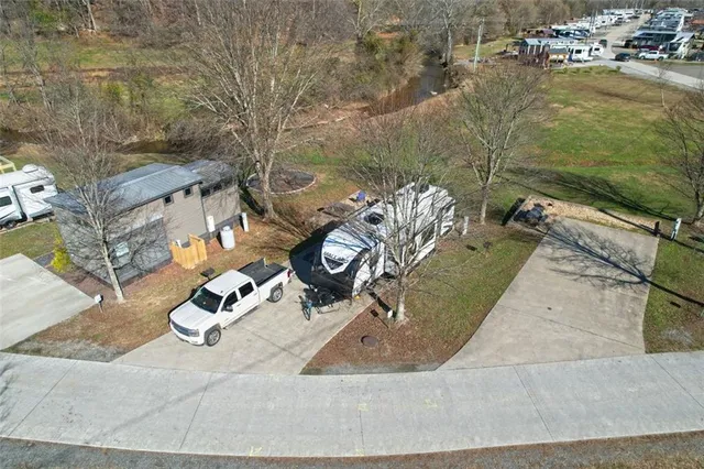 an aerial view of a house with outdoor seating