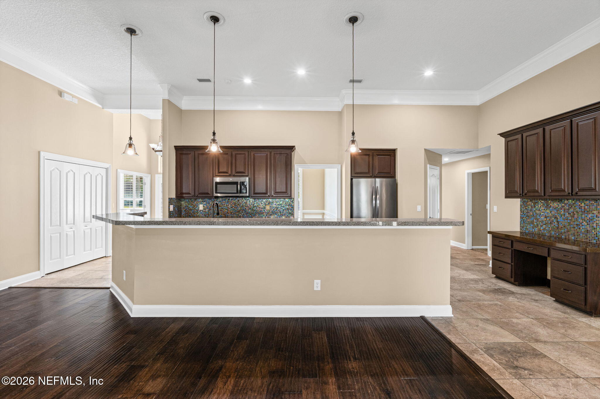 1600 Spring Water Court Fleming Island, FL 32003 - Photo 23 of 85 a view of kitchen with stainless steel appliances granite countertop cabinets and wooden floor