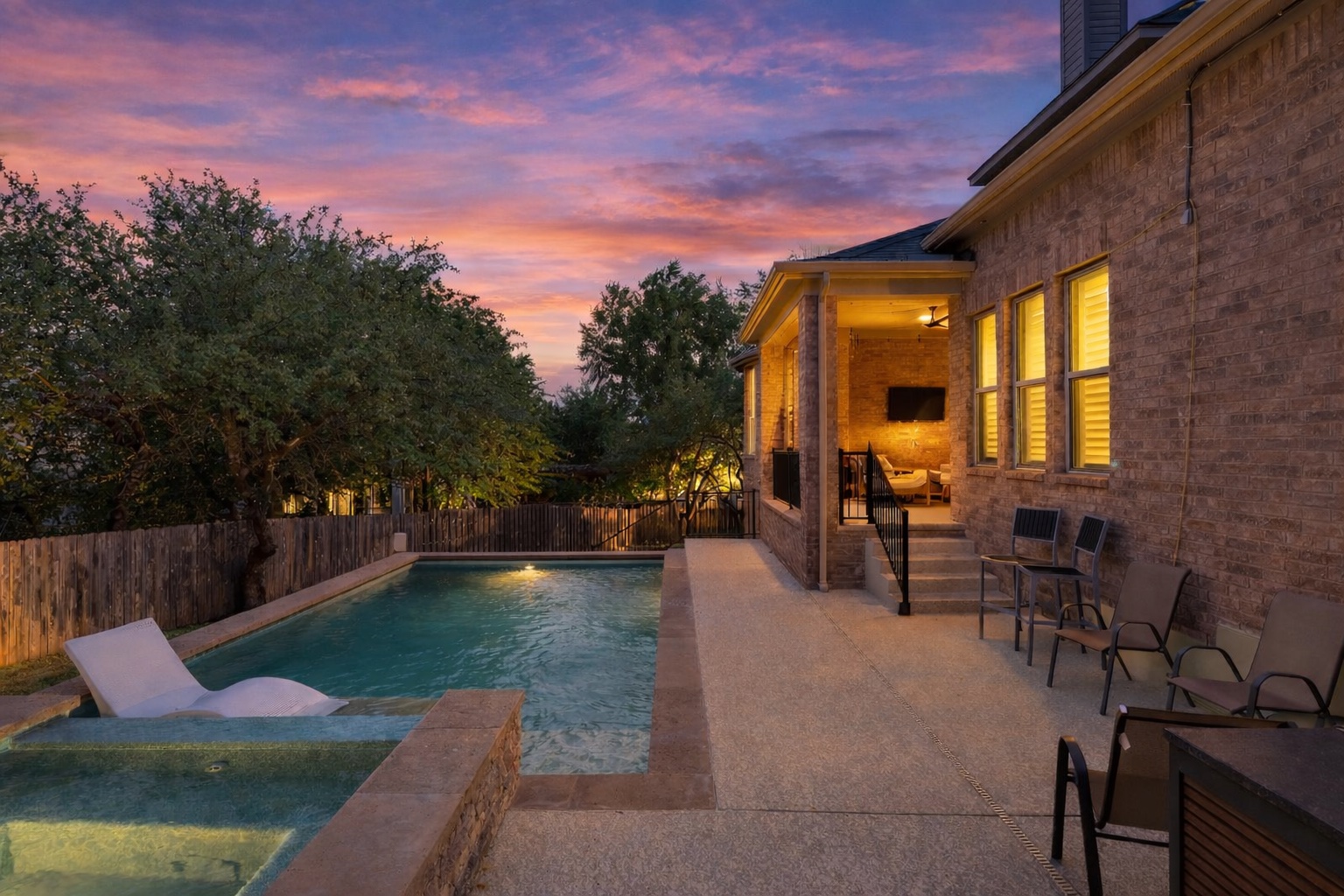 8801 Wild Rice Cove Austin, TX 78738 - Photo 2 of 40 a view of a swimming pool with sitting area