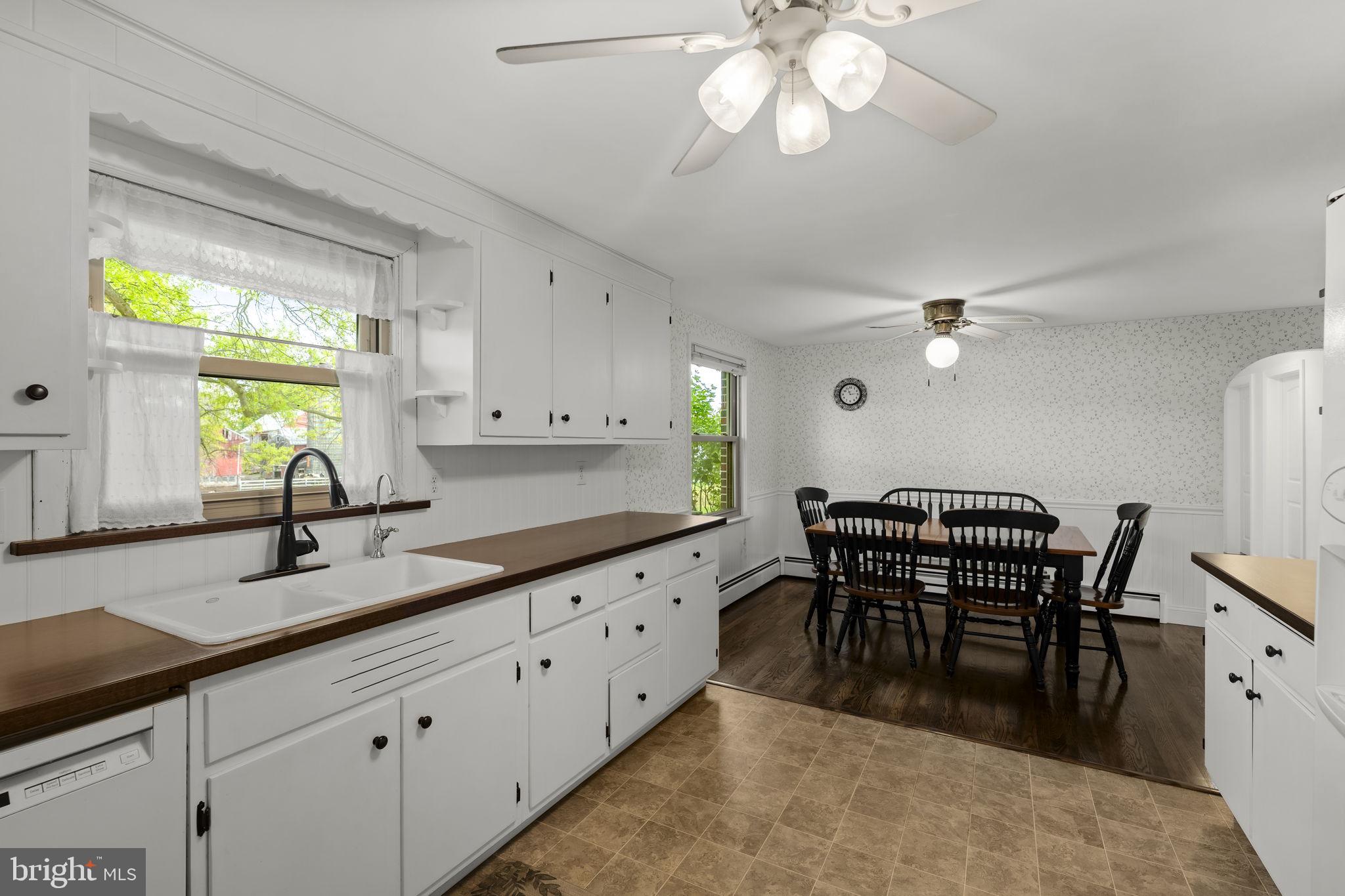 1160 Narvon Road Narvon, PA 17555 - Photo 35 of 64 a kitchen with granite countertop a sink chairs and white appliances