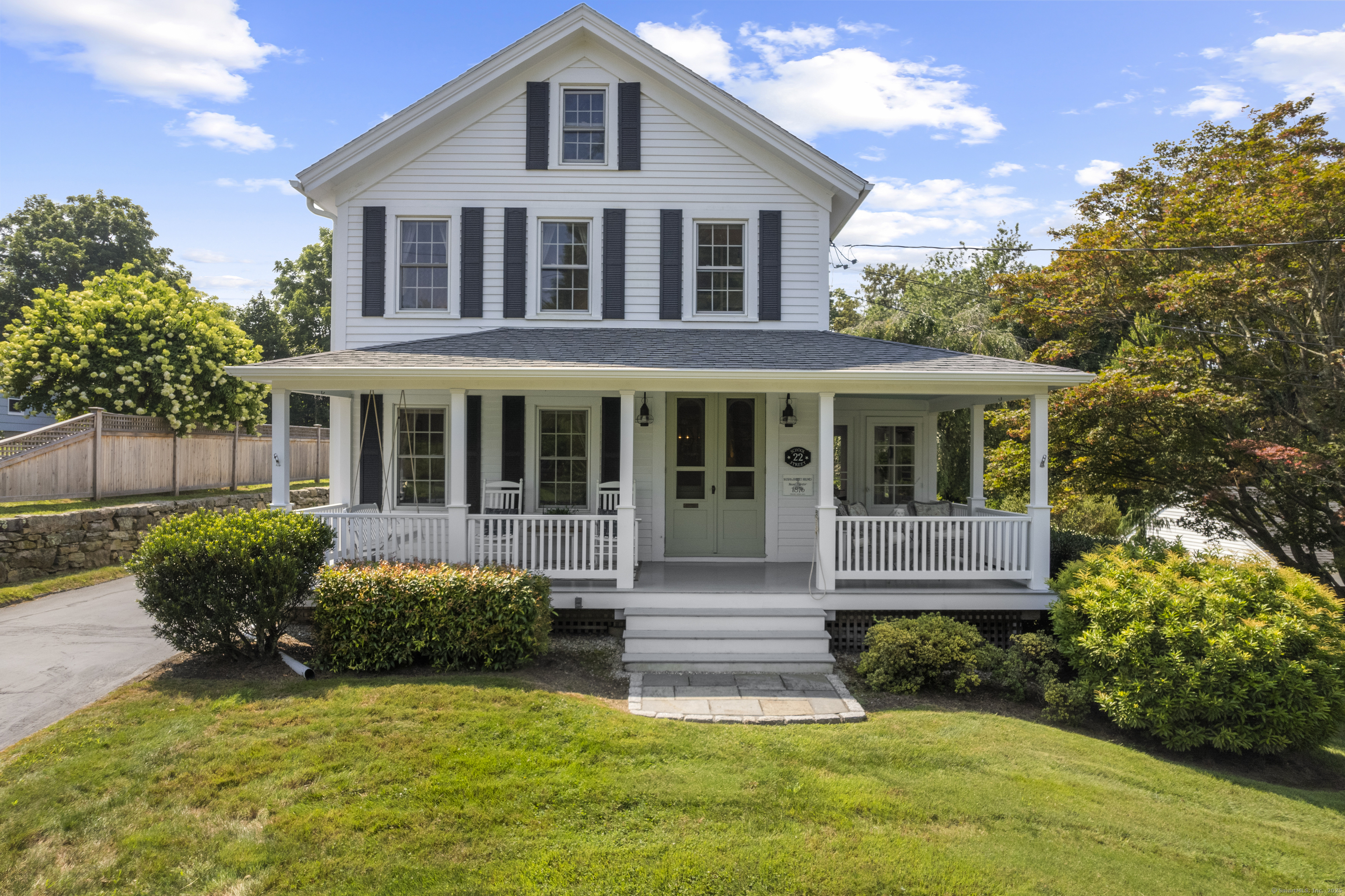 22 School Street Stonington, CT 06355 - Photo 1 of 39 a front view of a house with a yard