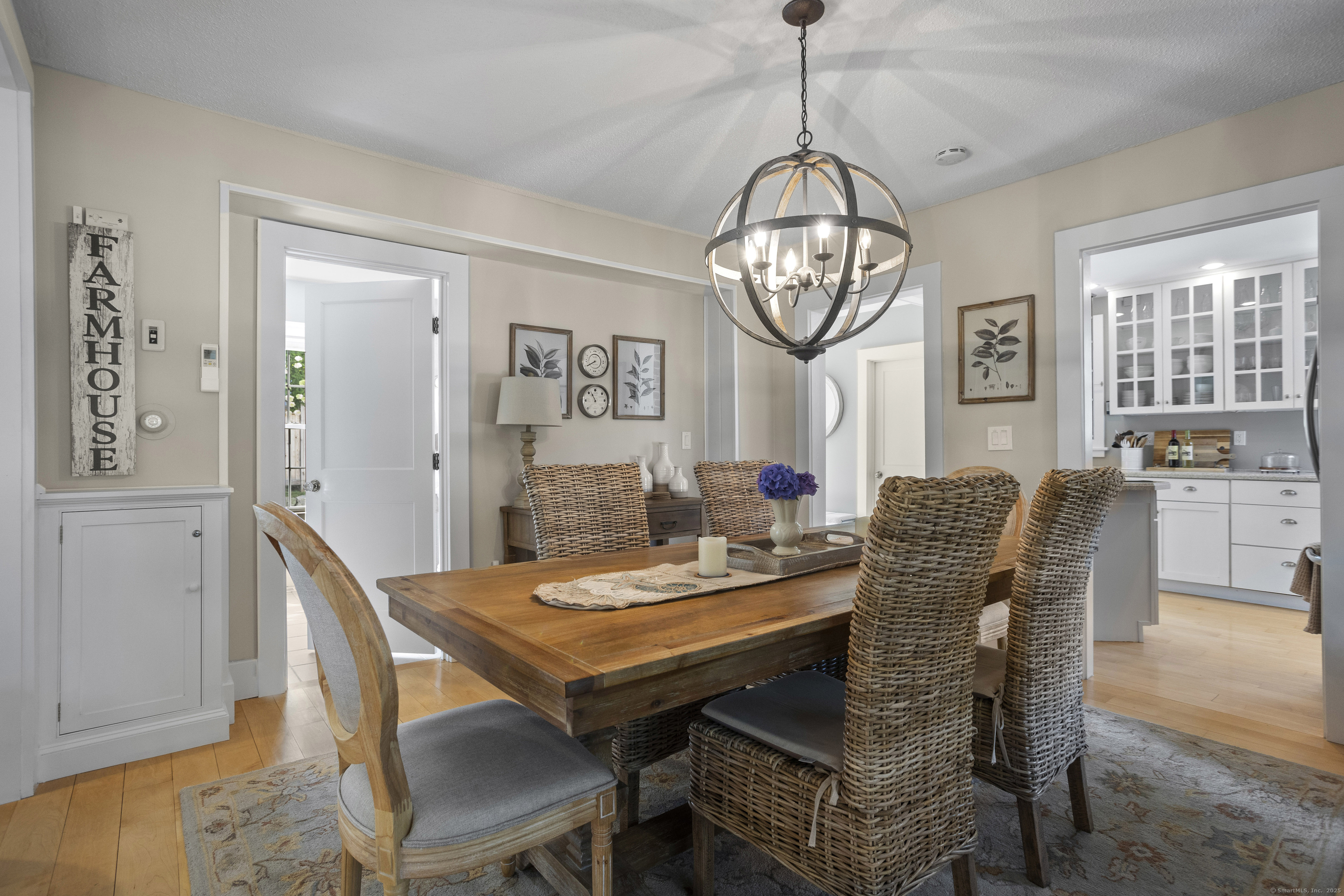 22 School Street Stonington, CT 06355 - Photo 11 of 39 a view of a dining room with furniture window and wooden floor