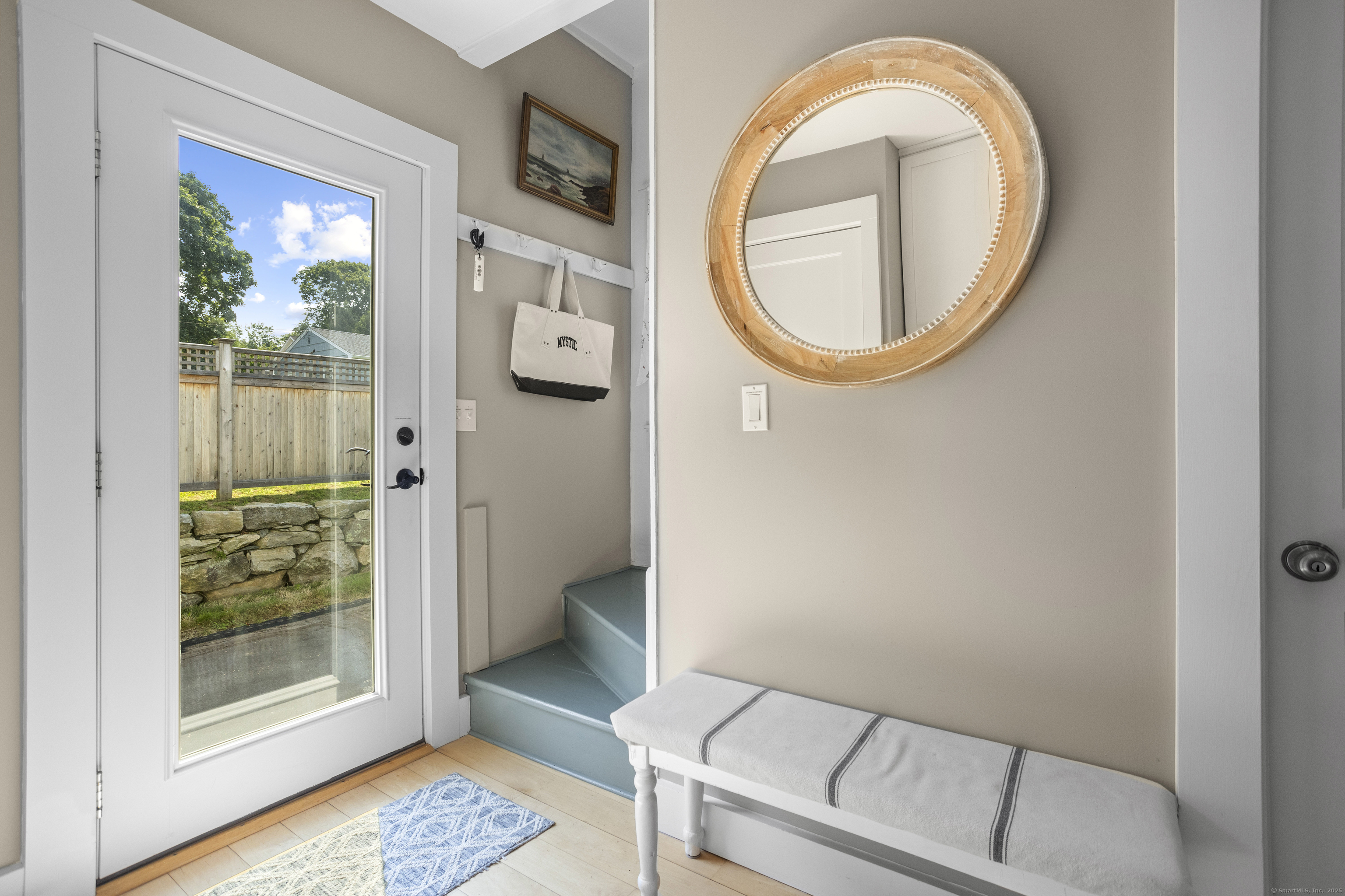 22 School Street Stonington, CT 06355 - Photo 18 of 39 a bathroom with a sink and a mirror