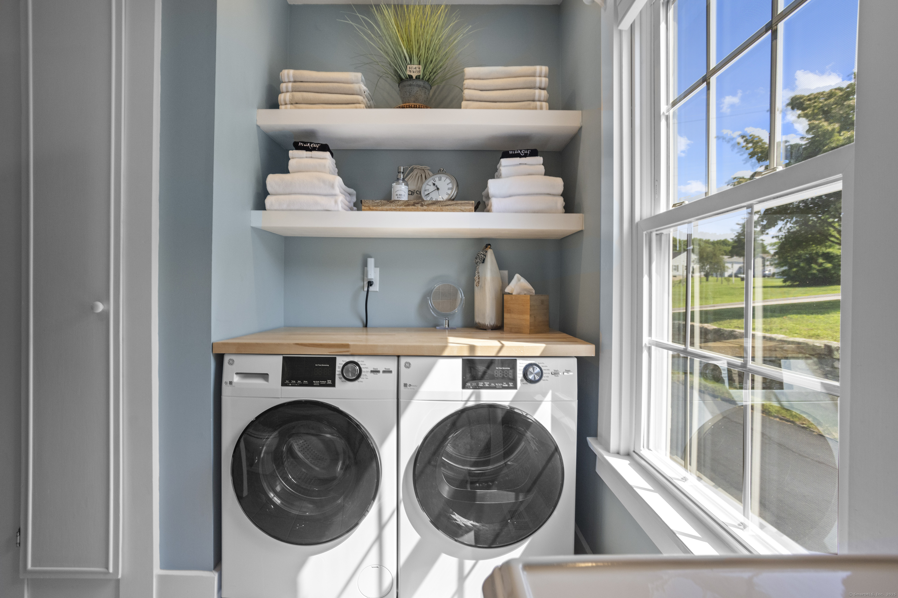 22 School Street Stonington, CT 06355 - Photo 19 of 39 a view of washer and dryer in a room