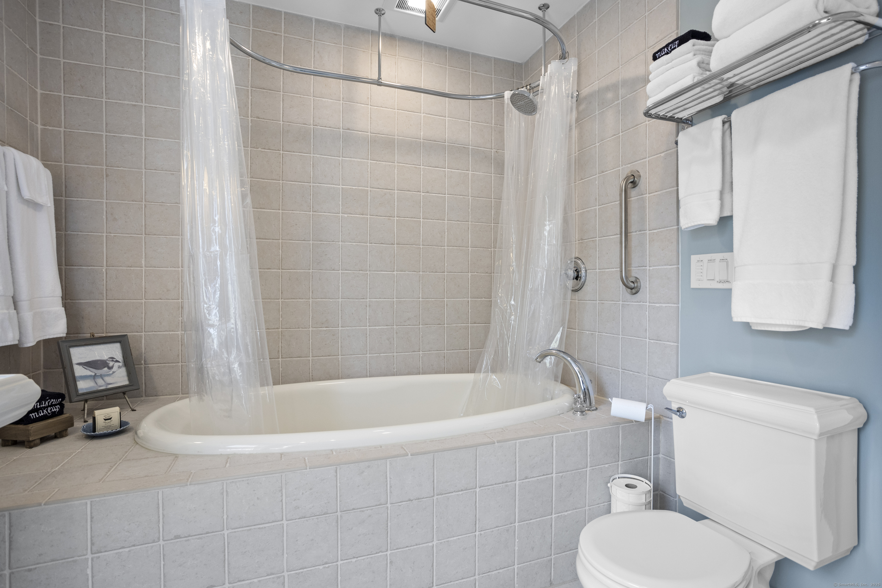 22 School Street Stonington, CT 06355 - Photo 20 of 39 a bath room with a toilet a bath tub and a shower