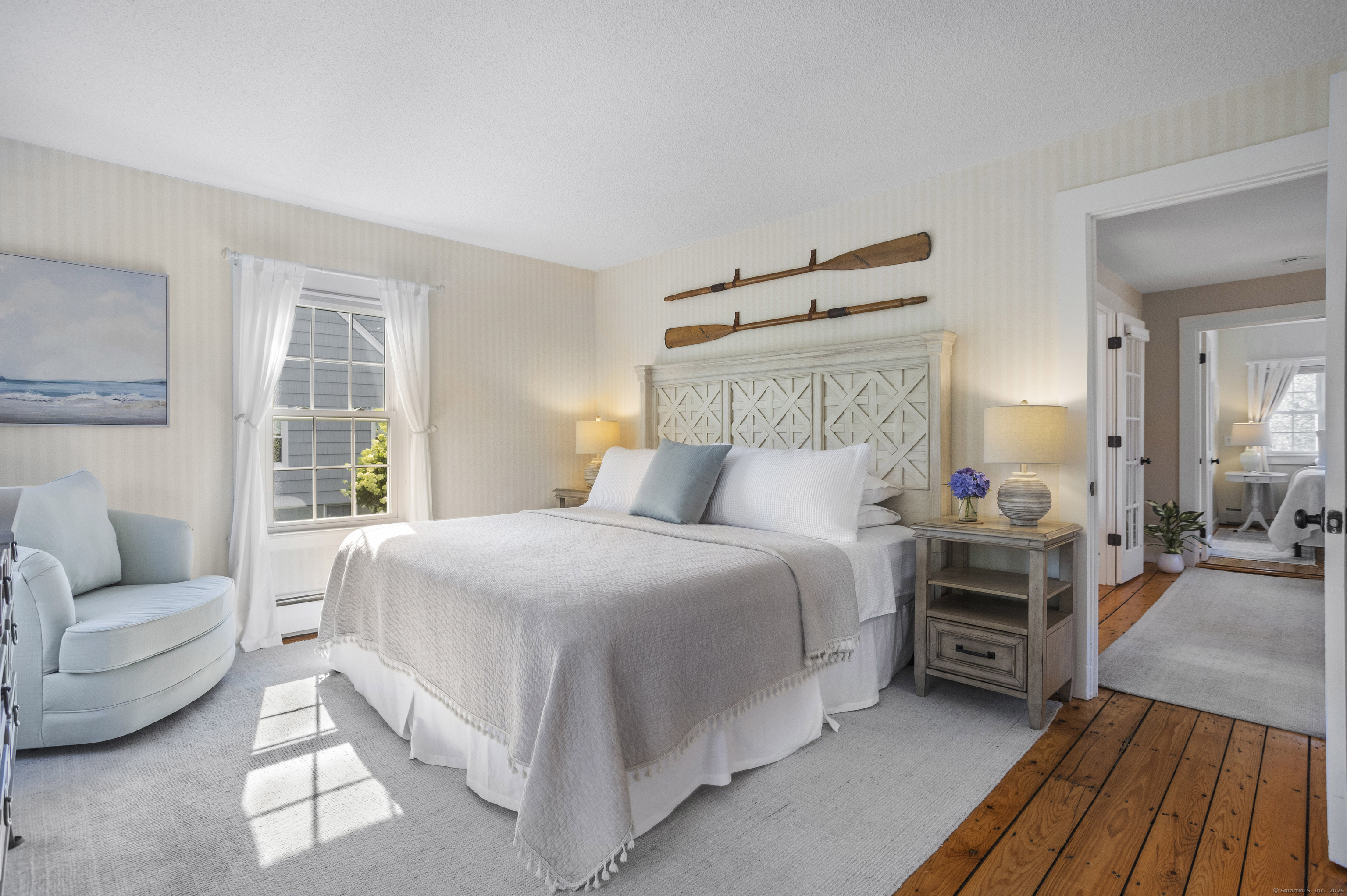 22 School Street Stonington, CT 06355 - Photo 23 of 39 a bedroom with a bed and a couch