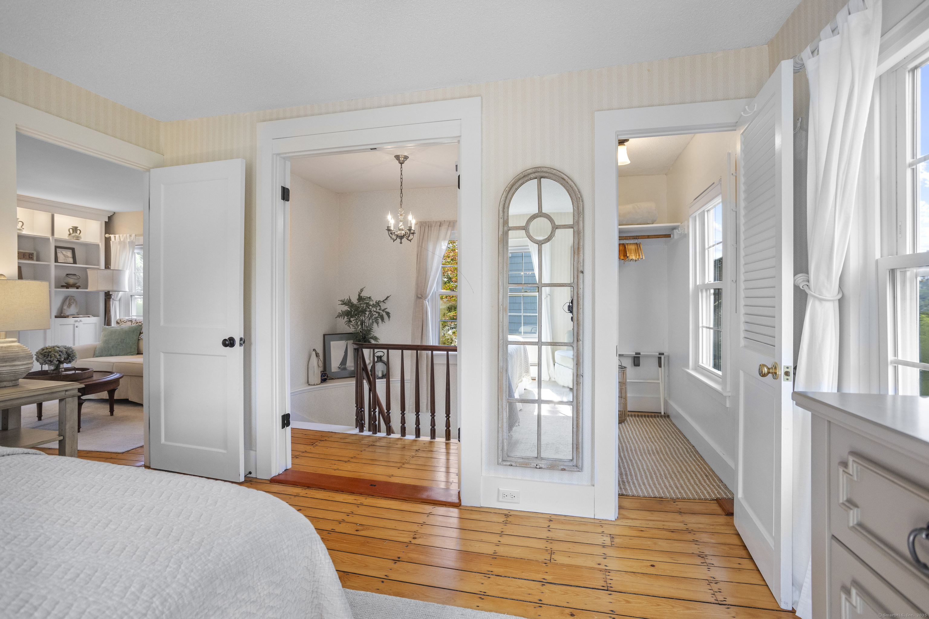 22 School Street Stonington, CT 06355 - Photo 24 of 39 a bedroom with wooden floor and windows