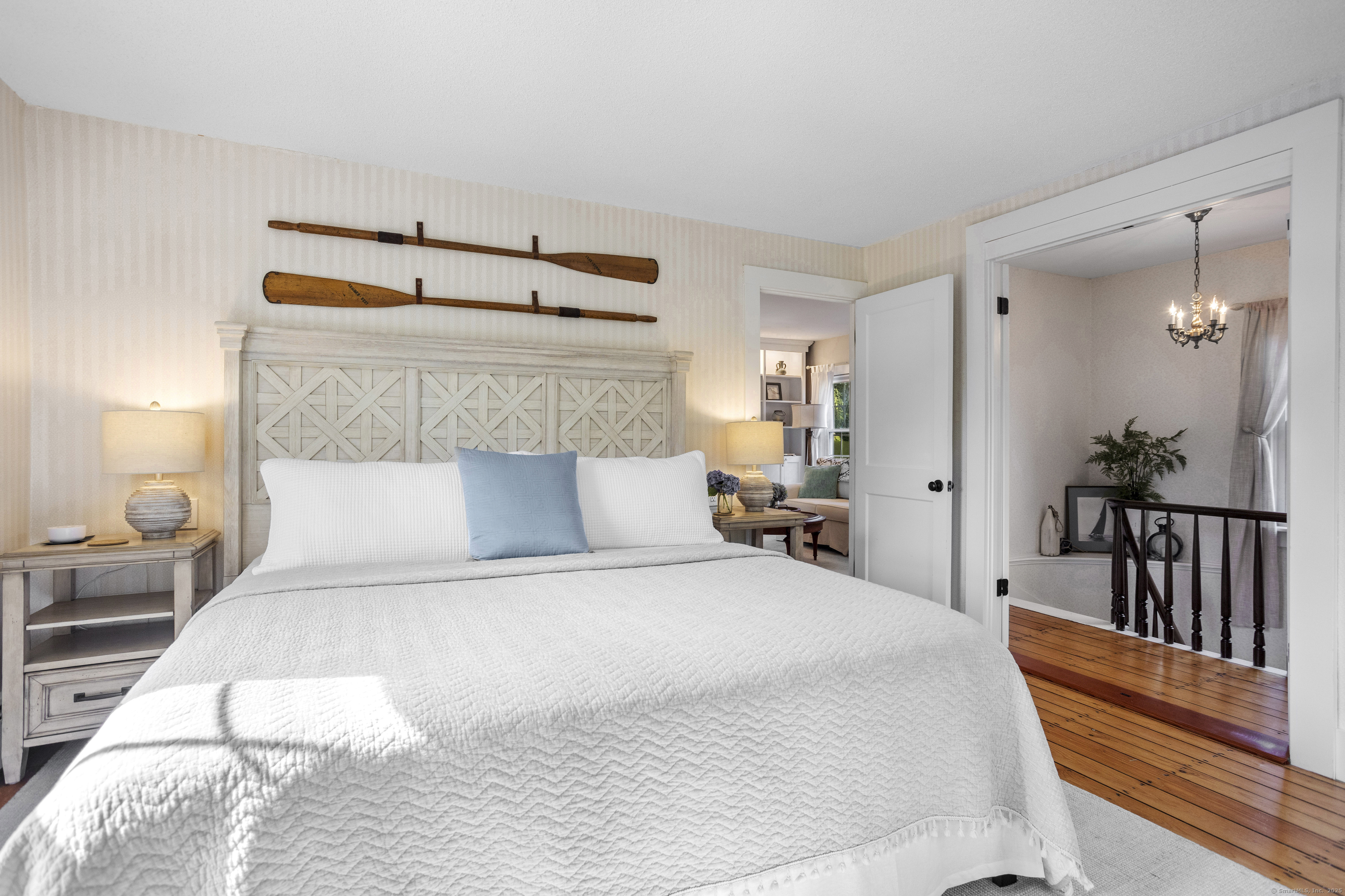 22 School Street Stonington, CT 06355 - Photo 25 of 39 a bedroom with a large bed and a night stand