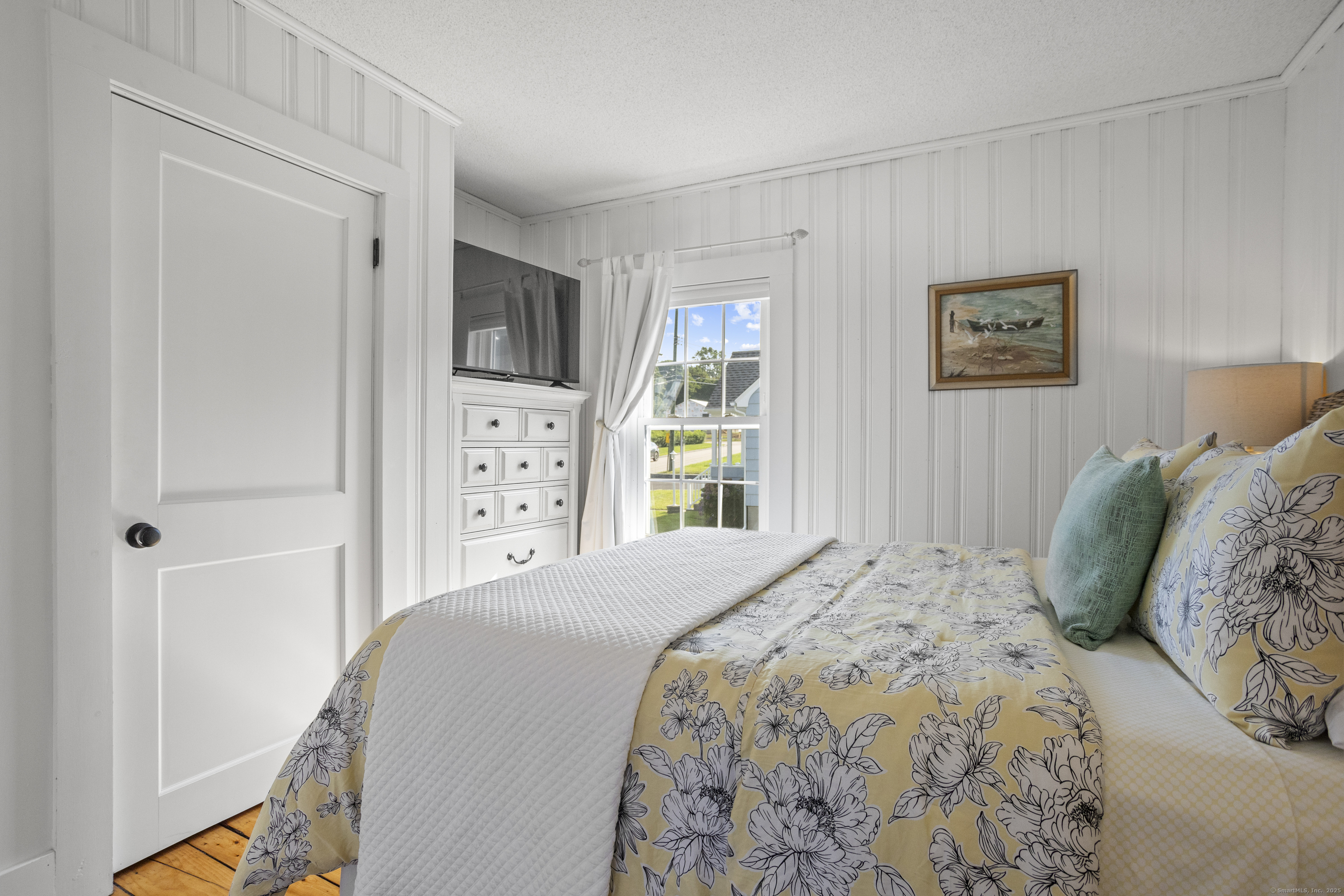 22 School Street Stonington, CT 06355 - Photo 29 of 39 a bedroom with a bed and a window