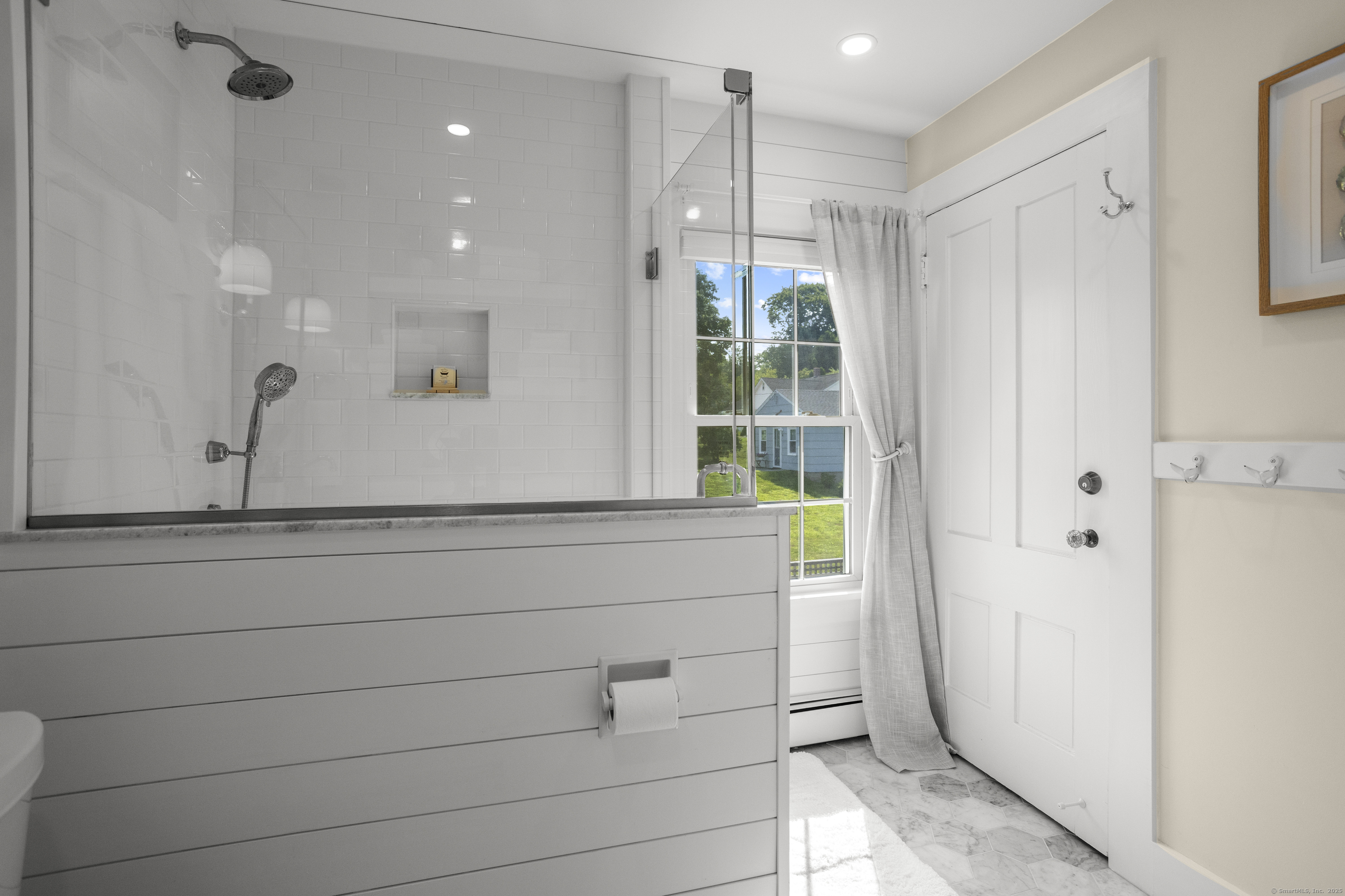 22 School Street Stonington, CT 06355 - Photo 31 of 39 a bathroom with a shower and a window