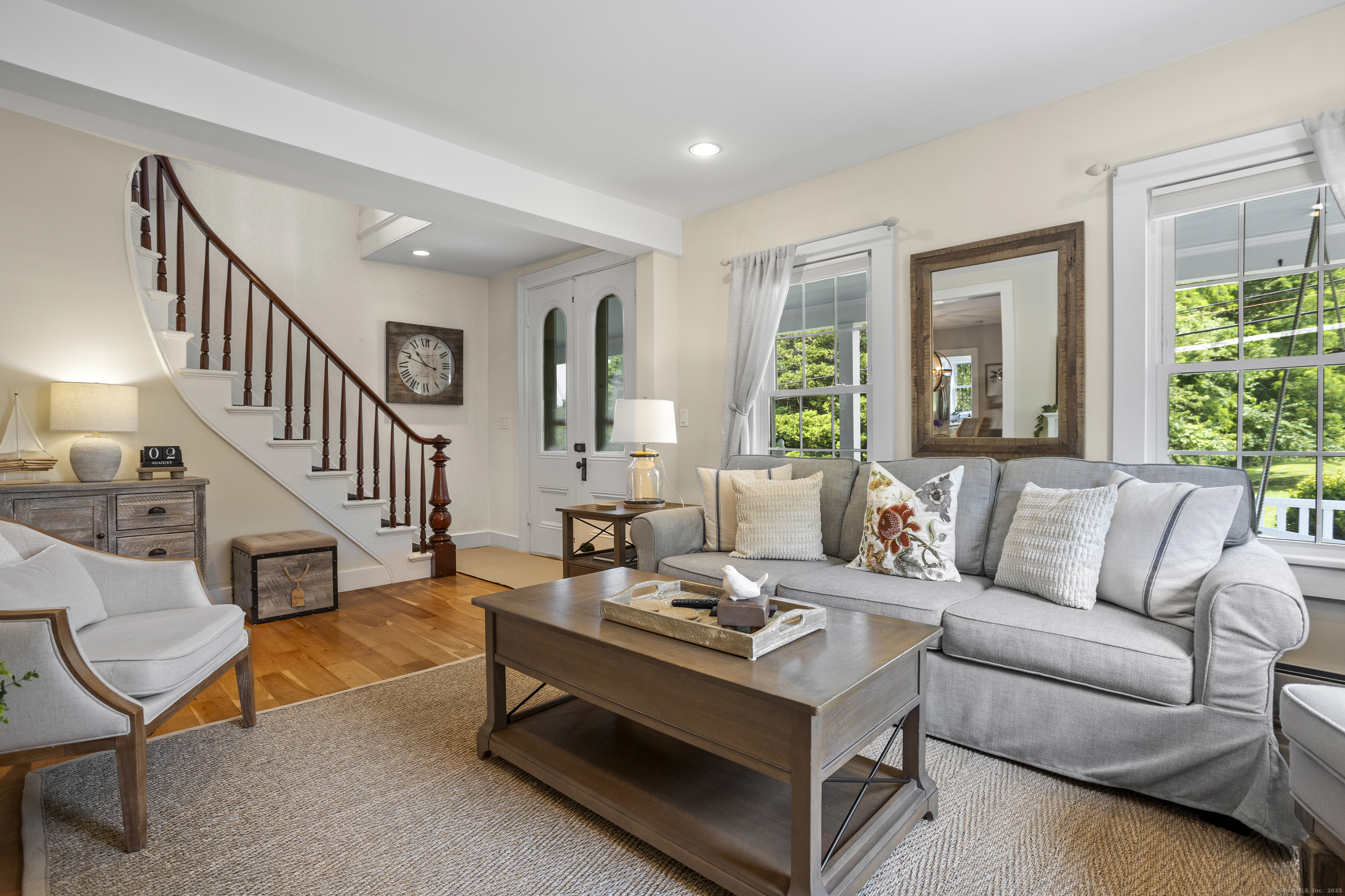 22 School Street Stonington, CT 06355 - Photo 6 of 39 a living room with furniture and a table