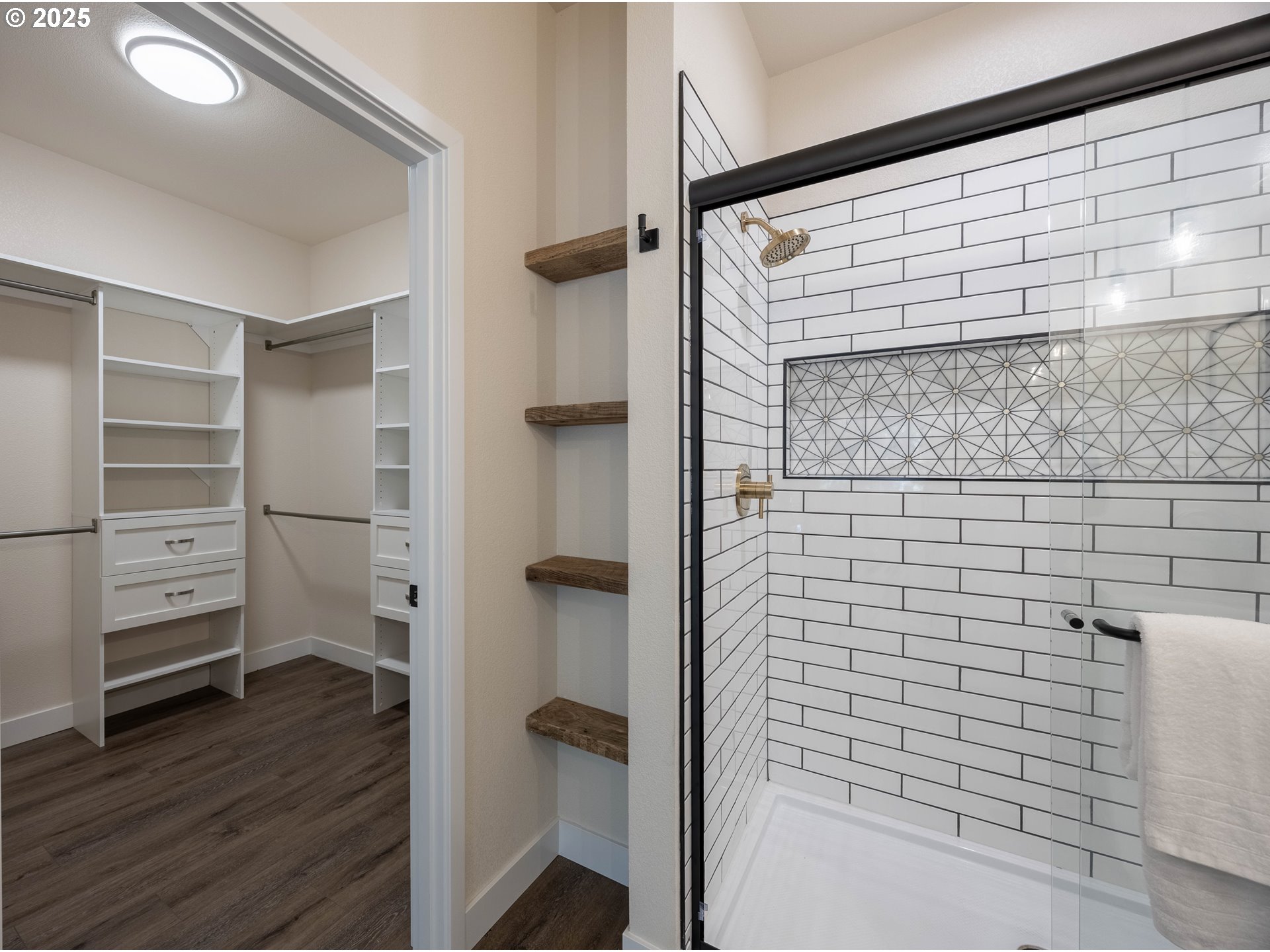 1 Bonnett Way Florence, OR 97439 - Photo 15 of 33 a bathroom with a walk in closet and wooden floor