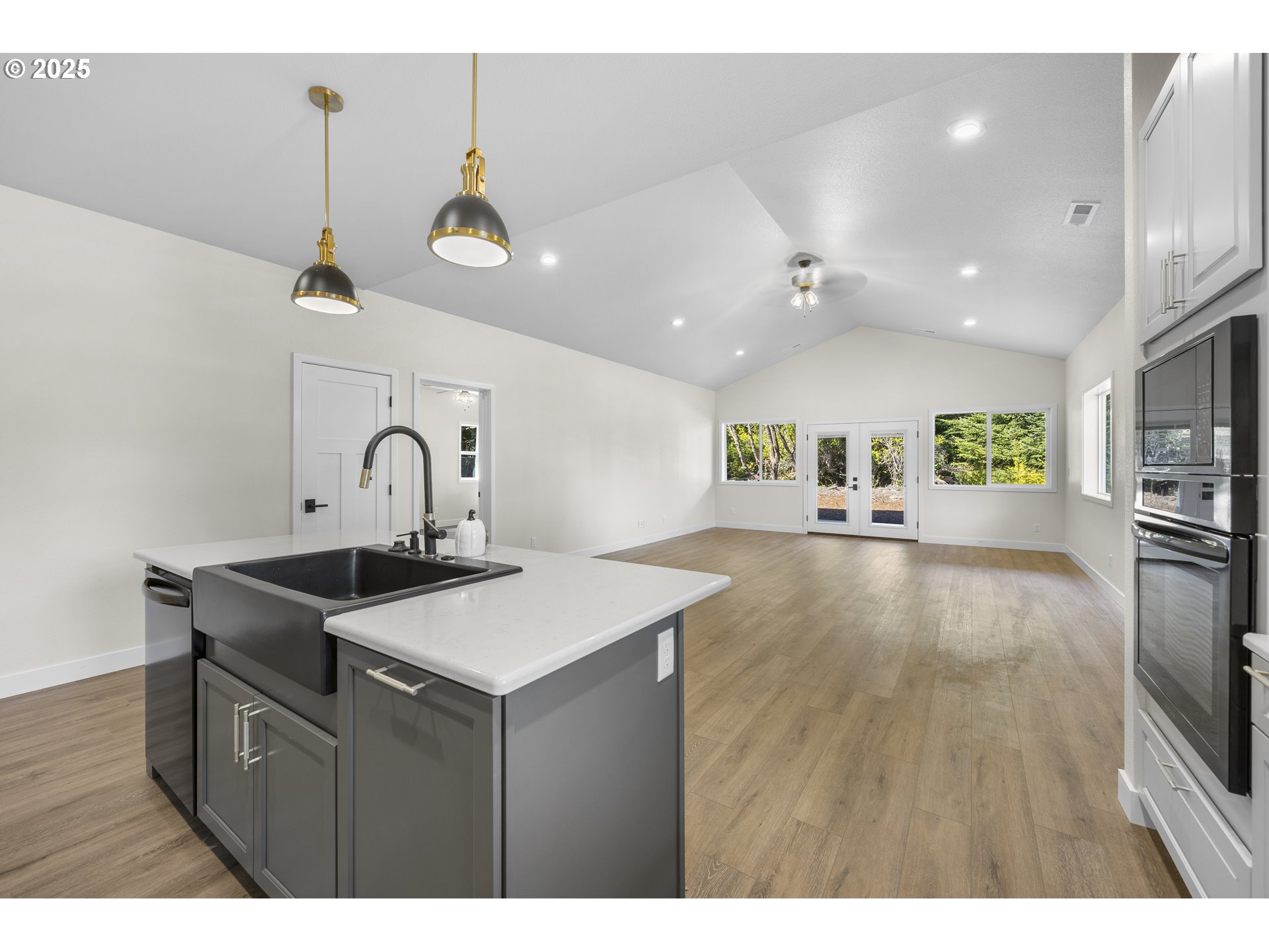 1 Bonnett Way Florence, OR 97439 - Photo 8 of 33 a kitchen with a sink cabinets and wooden floor